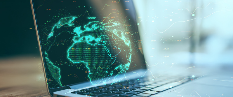 Laptop displaying a digital map of Earth with network and data visualizations